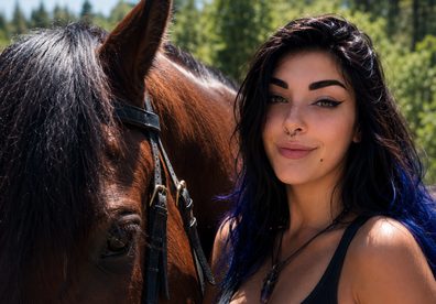 Kayla beside a horse